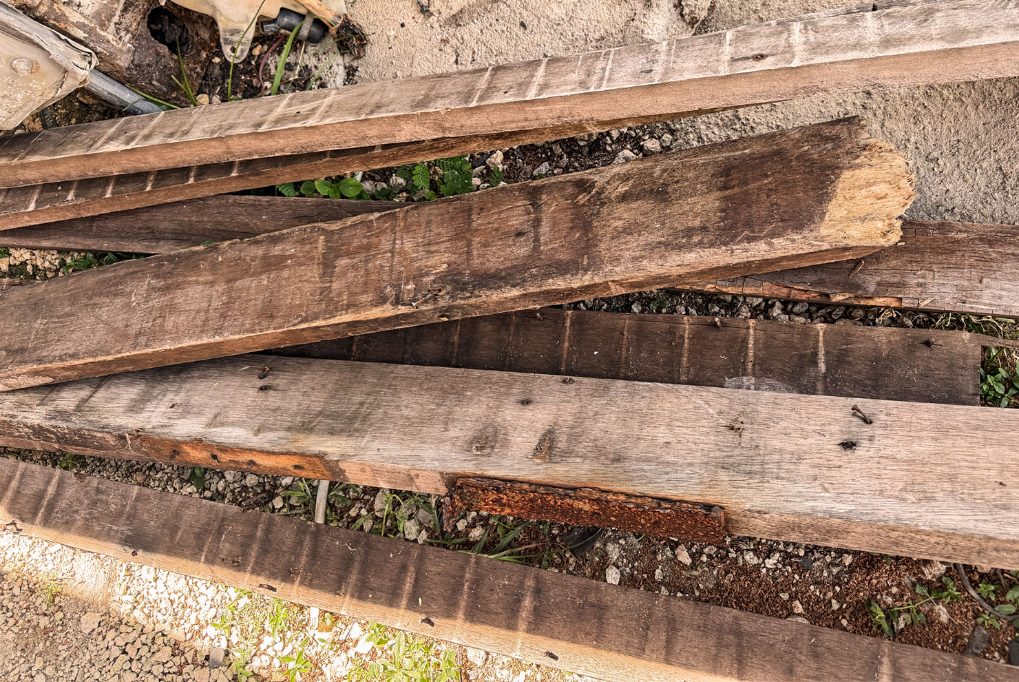 Salvaged Guam mahogany boards reclaimed from Flores warehouse